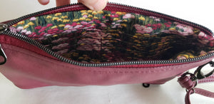 One side of bag open - showing interior card slots and cash slip pocket